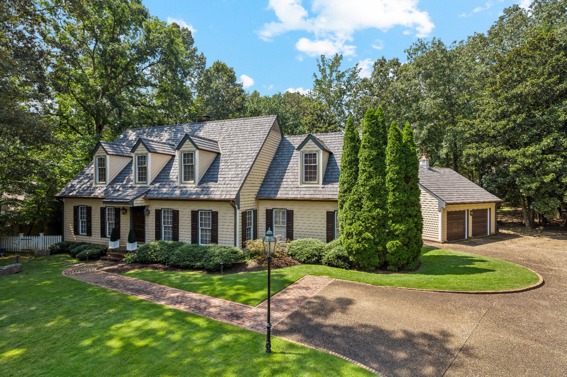 Suffolk County home featuring a Brava composite cedar shake roof